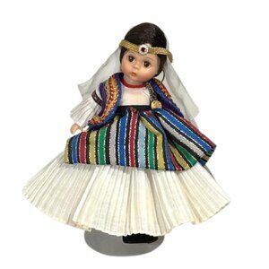 Madame Alexander restrung 8" Albania doll with stand.